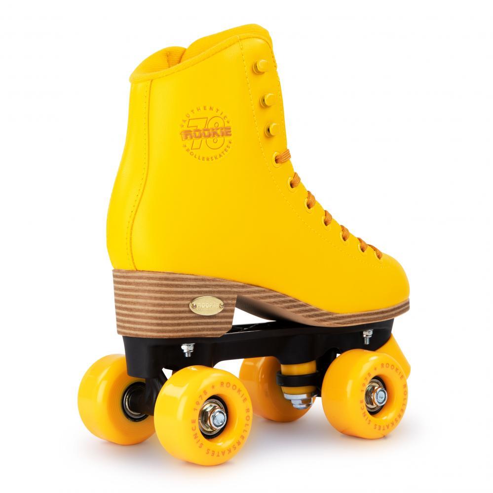 The Rookie Classic 78 Quad Roller Skates by Rookie feature a bright yellow high-top boot with black and yellow wheels. With their retro style and stitched logo, these vegan-friendly skates pop against a white backdrop.