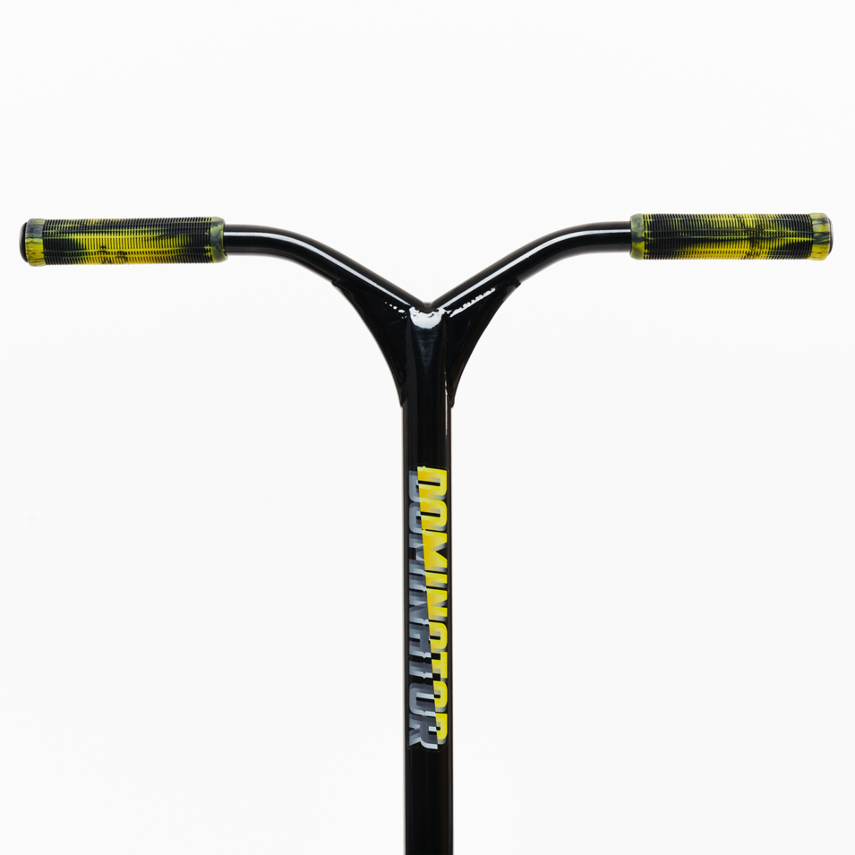 A close-up view of the Dominator Airborne Complete Stunt Scooter reveals a black handlebar adorned with vibrant yellow grips, ideal for riders ranging from intermediate to professional levels. The word "DOMINATOR" is vertically emblazoned on the stem, which is crafted from military-grade 6061 T6 aluminum. The background remains plain white.