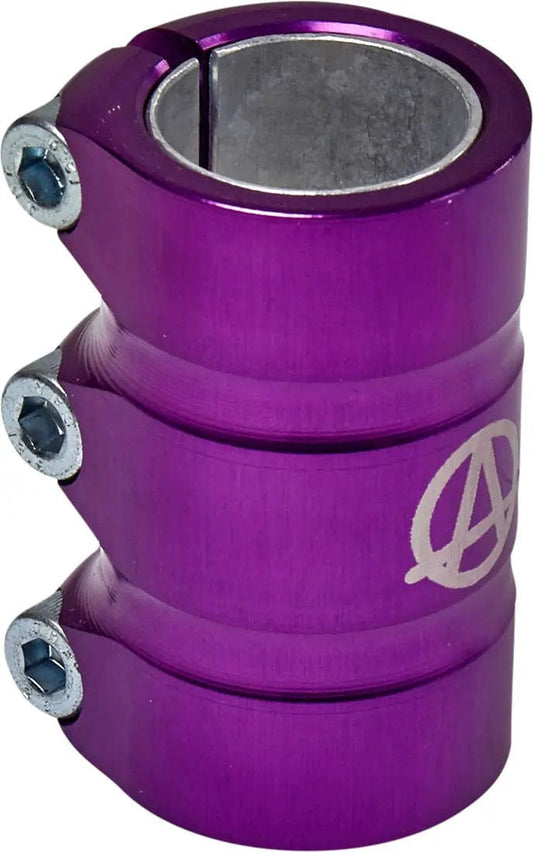 The Apex Gama 3 Bolt Oversized SCS Stunt Scooter Clamp in purple, manufactured by Apex, is a robust metal clamp with a glossy finish. It features three side bolts and boasts a logo of an "A" enclosed in a circle, designed for securely fastening cylindrical objects.