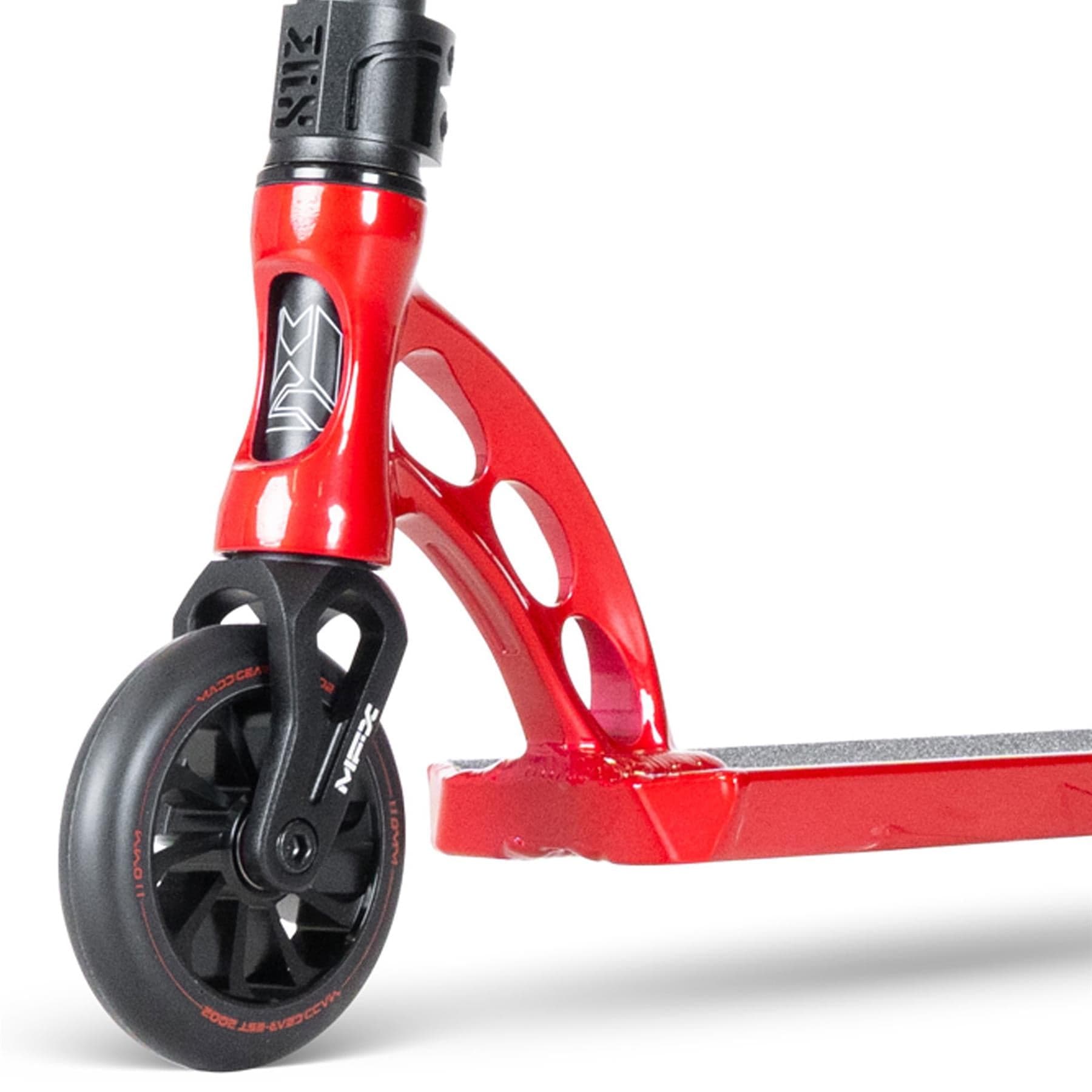 The Blood Red MGP VX Origin III 450 stunt scooter by Madd Gear showcases a close-up of the front wheel and deck, highlighting its black wheels with red lettering, sleek curved design, cutout frame details, and sturdy aluminum handlebars perfect for park riders.