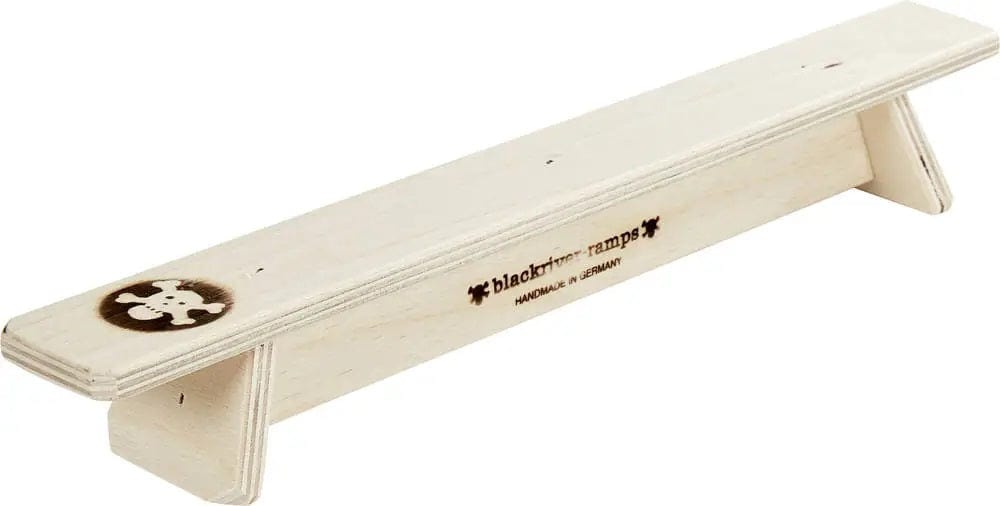 The Blackriver Fingerboard Grind Bench is a wooden balance board with a minimalistic design, showcasing the Blackriver logo and "Handmade in Germany" text printed in black. Perfect for street skateboarding enthusiasts, it rests on two raised wooden blocks and serves as an ideal unique fingerboard obstacle.