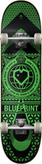 The Blueprint Home Heart Black / Green Complete Skateboard - 8" x 31.5" features a striking geometric and emblem design in green on a black background, along with the phrase "Home is where the heart is" and the word "Blueprint." With its 99A wheels, it is ideal for honing technical trick skills.