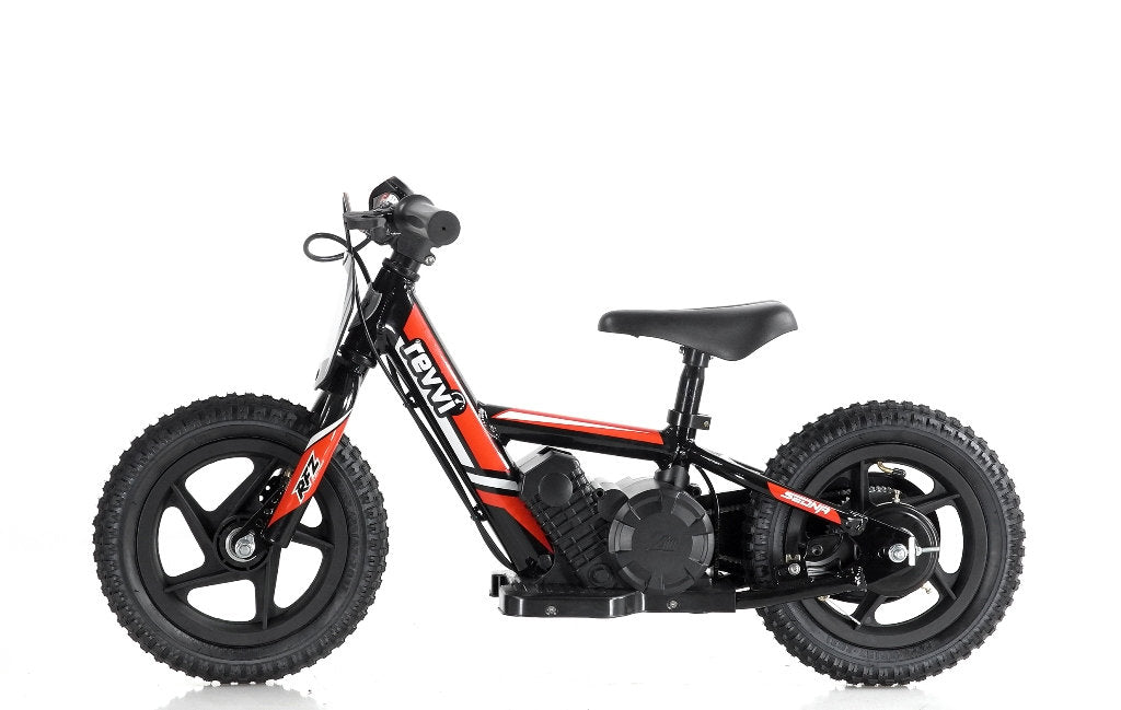 A compact Revvi 12" Kids Electric Balance Bike in black and red, featuring thick tires, a pedal-free design, and a robust frame, perfect for young riders working on balance and skill development.