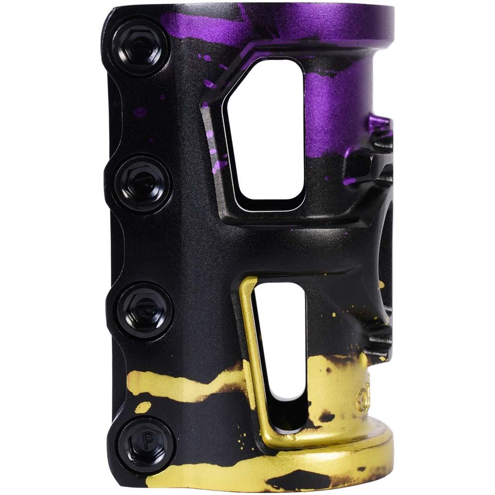 An up-close view of the Oath Cage V2 4 Bolt SCS Oversized Stunt Scooter Clamp in a black, purple, and yellow splatter design. Crafted from 6061 T6 Aluminium by Oath, this clamp incorporates multiple bolts for a reliable hold and features an open window to maintain its strength while staying lightweight for your scooter.