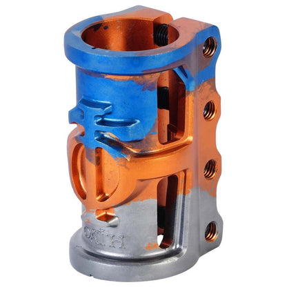 This component is reminiscent of the Oath Cage V2 4 Bolt SCS Oversized Stunt Scooter Clamp, featuring a striking blend of orange, blue, and titanium colors. It is made from 6061 T6 Aluminium to reduce weight and includes multiple screw holes, ribbed details, and engraved text at its base. This makes it suitable for various engineering or mechanical applications.