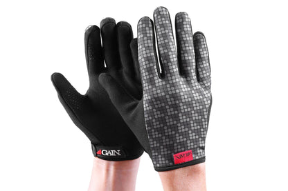 A pair of black GAIN Protection Resistance Skate Gloves - Logo, designed for durability with ARMORTEX fabric, features one glove's textured palm and the other's patterned back. These gloves are adorned with red GAIN logo tags on the wrist area and offer touchscreen compatibility for convenience.