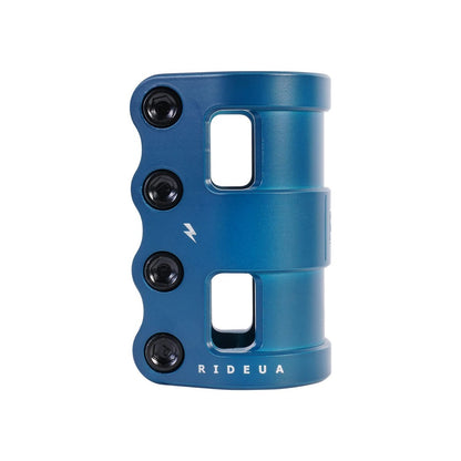 The UrbanArtt Civic 4 Bolt SCS Stunt Scooter Clamp - Arctic Blue is an excellent option for scooter enthusiasts. Made from durable 6061-T6 aluminum, this blue clamp includes four black bolts and two rectangular cutouts adorned with a lightning bolt icon. The "RIDEUA" logo is prominently displayed at the bottom.