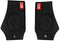 The CORE Ankle Skate Protection Sleeve - Black comes in a pair, featuring "CORE" branding at the top in red. Designed for extreme sports, these supports have shock-absorbing gel for cushioning every step. The left sleeve is marked with "L" and the right with "R," ensuring a precise fit and comfort.