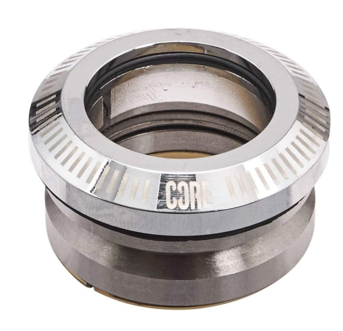 A mechanical component with a circular design, resembling a compression disk, and labeled "CORE" on the side. It features grooves and both shiny and textured surfaces, suggesting it’s part of a larger machinery system.