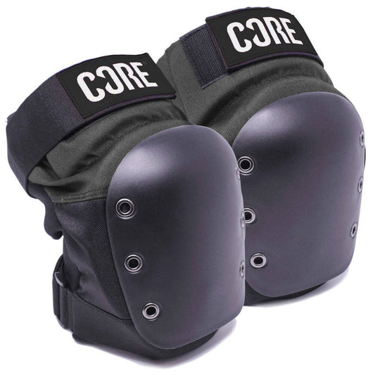 A pair of CORE Pro Street Knee Skate Protection Pads in black and grey, featuring hard shell covers, breathable neoprene lining, and EVA foam cushioning for comfort. Adjustable straps provide a secure fit, with the brand name "CORE" prominently displayed on the top of each pad.