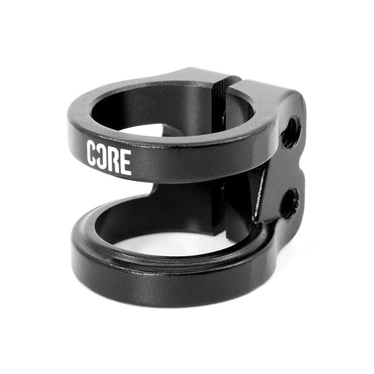 The CORE Venom 2 Bolt Oversized Stunt Scooter Clamp in black consists of two circular bolts and prominently displays the "CORE" branding. It is designed as an oversized double clamp with two screw holes for secure fastening.