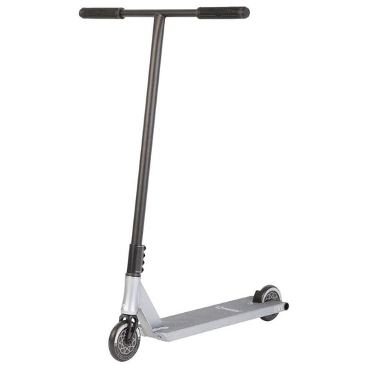 The Invert Curbside Complete Street Stunt Scooter - Titanium Silver (L) features a sleek, modern design with a silver deck and durable chromoly steel bars. Its black handlebars and alloy core wheels boost performance, making it an ideal choice for urban commuting or recreational use.