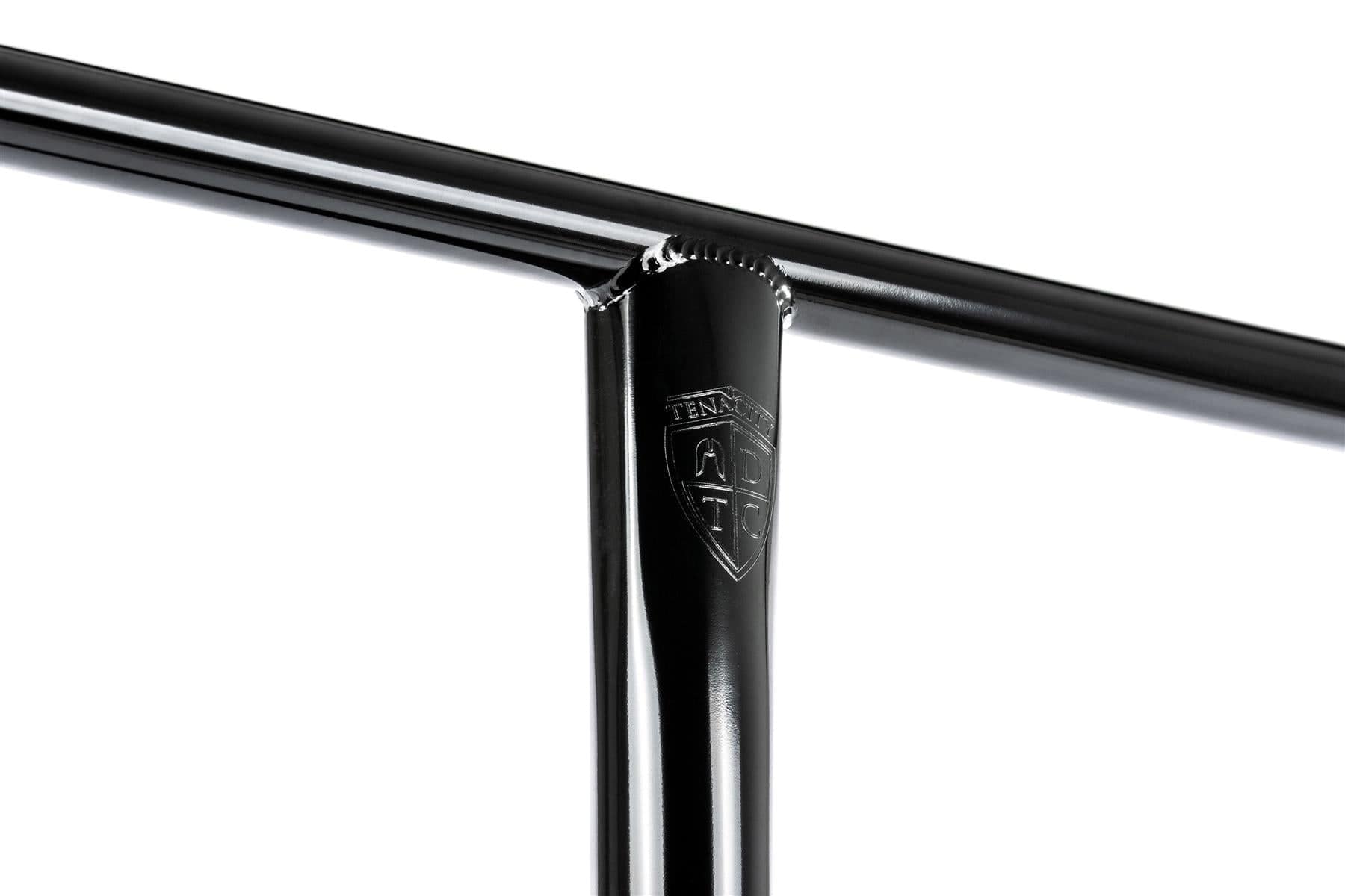 Close-up of Ethic DTC Tenacity V2 Steel HIC Stunt Scooter T-Bars in Black Mirror, featuring shiny, smooth, lightweight handlebars with a T-shaped design. The engraved "TENAC" logo adorns the vertical bar near the intersection, reflecting light elegantly. Dimensions: 670mm x 600mm.