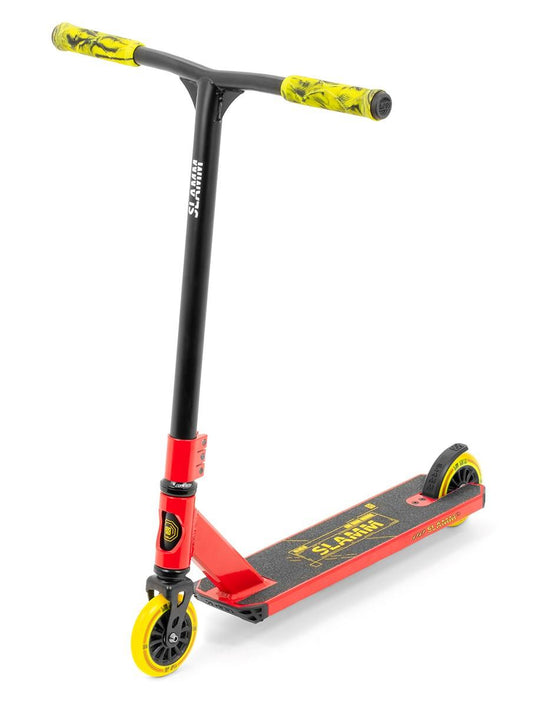 Introducing the Slamm Classic Mini Complete Stunt Scooter in red, an entry-level scooter perfect for freestyle enthusiasts. This model features yellow and black grips, a sleek black deck with "SLAMM" in bold yellow letters, and matching wheels. The scooter is elegantly angled slightly to the right for optimal performance.