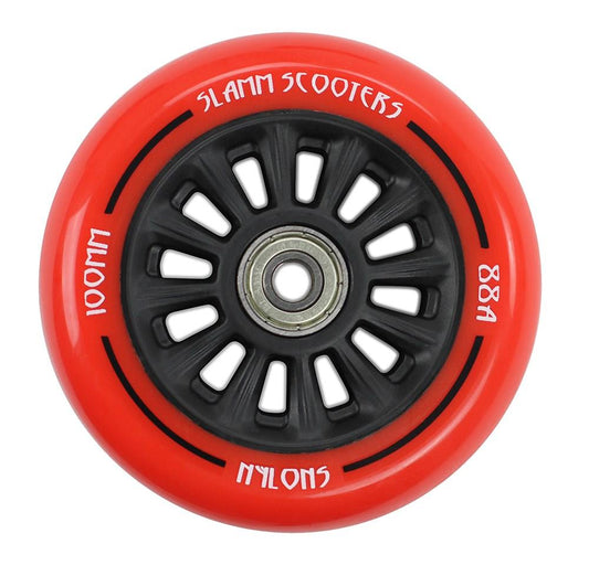 The Slamm Nylon Core 100mm Stunt Scooter Wheel - Red is a product from the brand Slamm, featuring a red and black design with a metallic center bearing and ABEC 9 Chrome Bearings for superior performance. White text on the wheel displays "100mm" and "88A." Its sporty look includes a durable polyurethane composite with multiple spokes.