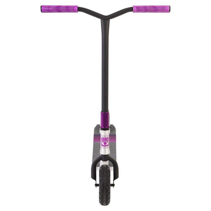 Introducing the Invert Supreme Taunt Dirt Scooter in Raw, Pink, and Purple: This stylish two-wheeled scooter features a T-bar handle and a front view design. The fully integrated headset enhances the vibrant purple handlebars and accents of its predominantly black frame.