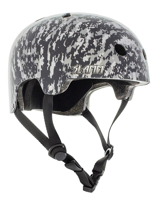 The Slamm Logo Skate / Scooter Helmet, perfect for scooter enthusiasts, features a grey camouflage design with "SLAMM" prominently displayed on the side. It complies with EN1078 safety regulations and includes multiple air vents as well as adjustable black straps for a secure fit.