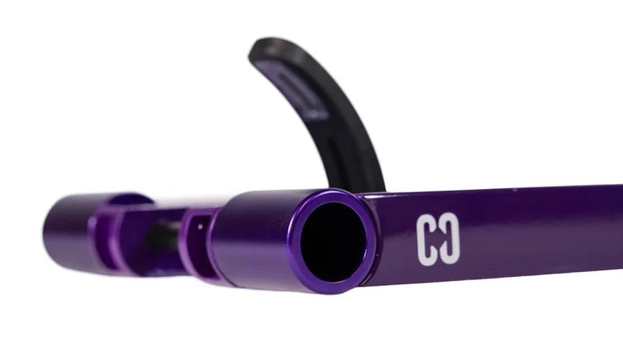 Close-up of the metallic purple CORE ST2 Jack 'Halfbarz' Ward Signature scooter deck, 6" x 21", with a circular cutout and black rear brake. Designed for hybrid riding, it features a glossy finish and white logo on the side.