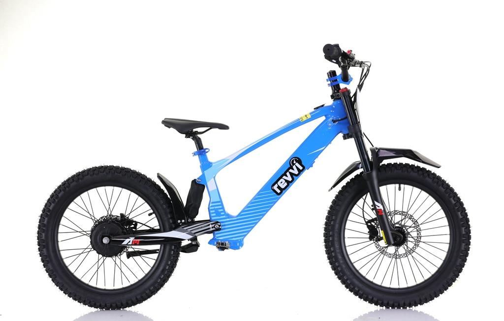 The Revvi 20" Kids Electric Balance Bike in blue features a durable frame and thick tires for off-road adventures. It has a built-in battery, a small front fender, and sleek branding on the frame, beautifully showcased in this side-view against a white backdrop.