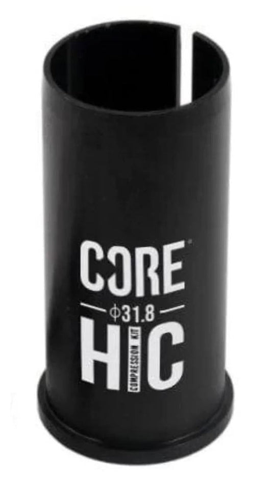 The CORE HIC Scooter Conversion Shim - Black, part of the HIC Conversion Kit, showcases "CORE HIC" and "Φ31.8" in white on its surface. This black metal cylindrical piece with a split down one side is ideal for incorporating oversized bars into your scooter setup.