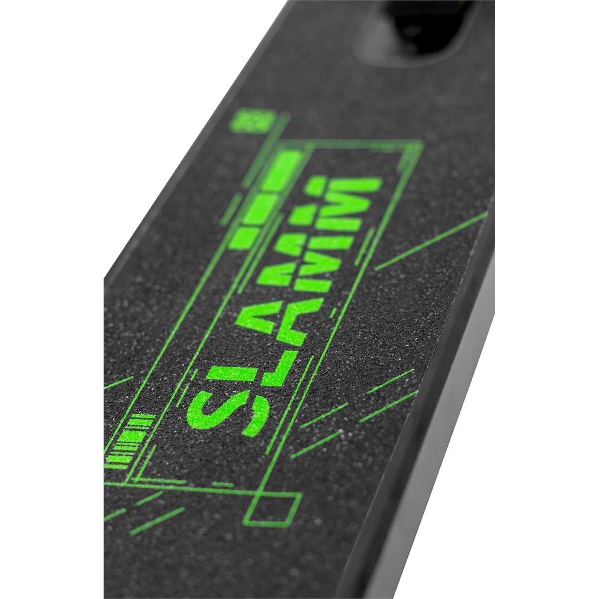 Close-up of a skateboard deck featuring a textured black surface. The brand name "Slamm" is prominently displayed in bright green, with angular, geometric accents surrounding it, evoking the bold style associated with the Slamm Classic Mini Complete Stunt Scooter - Green and creating a modern and dynamic look.