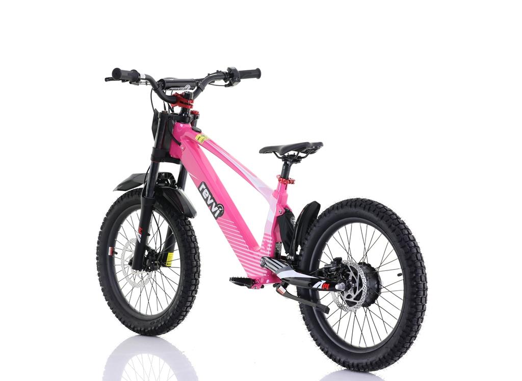 The Revvi 20" Kids Electric Balance Bike in pink stands against a white backdrop. This sleek, sporty design features front and rear suspension, disc brakes, and adjustable speed settings, making it perfect for young adventurers.