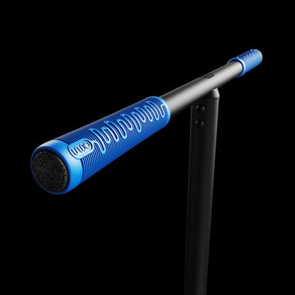 A sleek blue and black baseball bat is shown horizontally on a black background, featuring textured grip details reminiscent of the INDO Pro V2 Indoor Trampoline Stunt Scooter - Black/Blue, with a black stand for support.