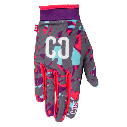 Introducing the CORE Aero Skate Protection Gloves - Neon Splat, vibrant gloves designed with abstract patterns in purple, teal, and red. These gloves feature "CO" initials on the back and are accented with red trims around the wrist and fingers. Plus, they are touch screen friendly, keeping you connected on every ride.