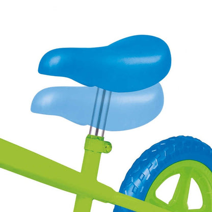 A close-up of the Ozbozz My First Balance Bike - Green / Blue highlights its vibrant green frame, large blue tire, and distinctly designed adjustable blue seat with dual layers for height adjustment. This delightful balance bike is elegantly set against a clean white backdrop.