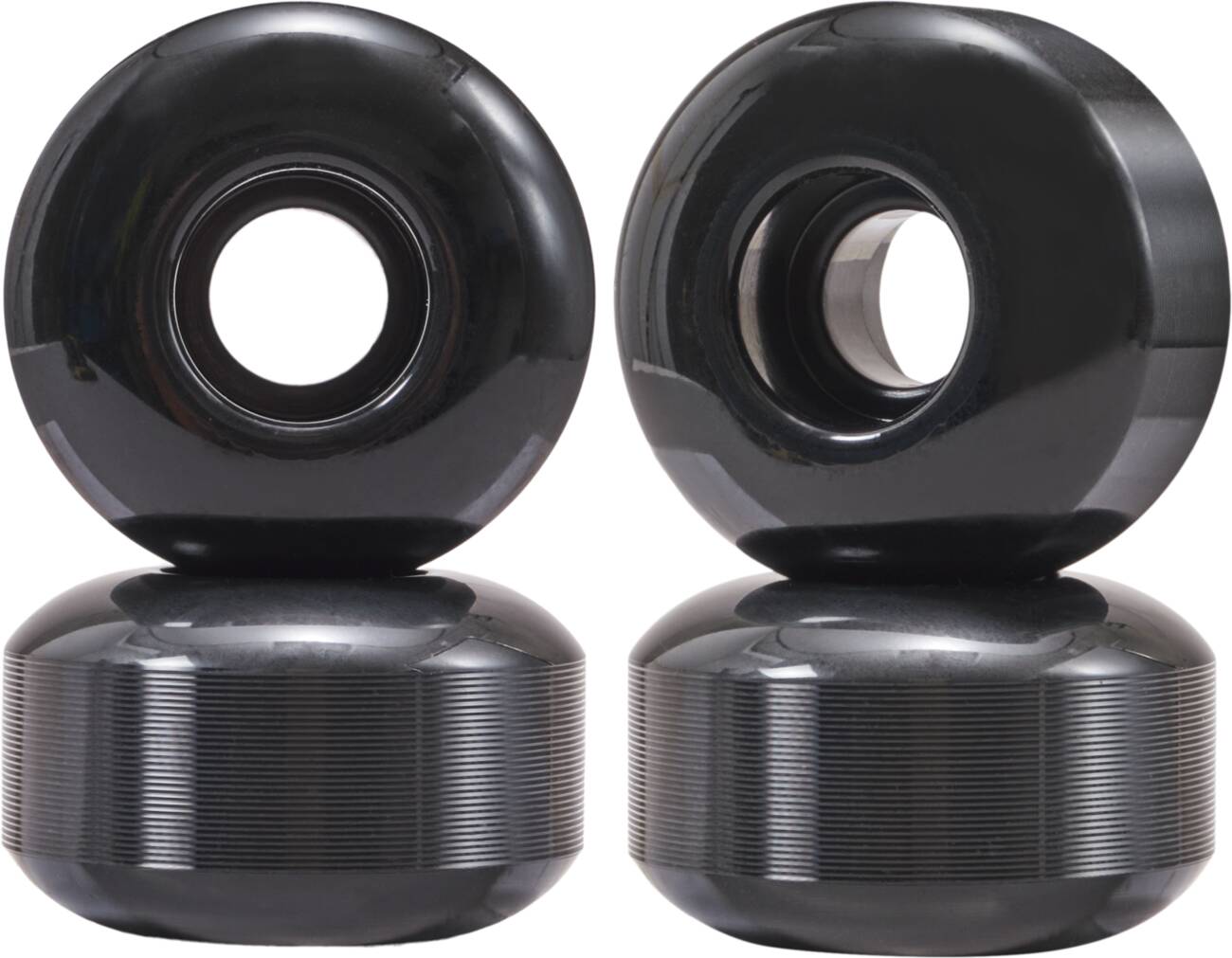 Four cost-effective Essentials 52mm 95A skateboard wheels in black are arranged in two pairs on a white background. These wheels feature a glossy finish with visible center holes, ensuring exceptional handling for smooth rides.