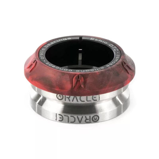 An Ethic DTC Osmose Silicone Integrated Stunt Scooter Headset in glossy red and black metallic, featuring the name "ORACLE" engraved around its lower section. The circular top has an opening with text around its edge, combining a sleek design with a bold presence.