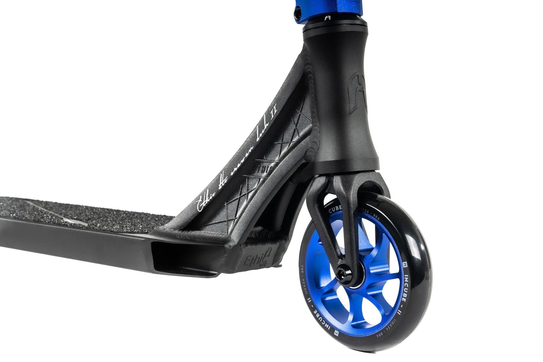 Close-up of the Ethic DTC Erawan V2 Complete Stunt Scooter in black, featuring striking blue metal core wheels. Designed with IHC compression, this Ethic scooter offers textured grip tape on the deck and a robust fork for exceptional stability, making it one of the lightest scooters tailored for performance enthusiasts.