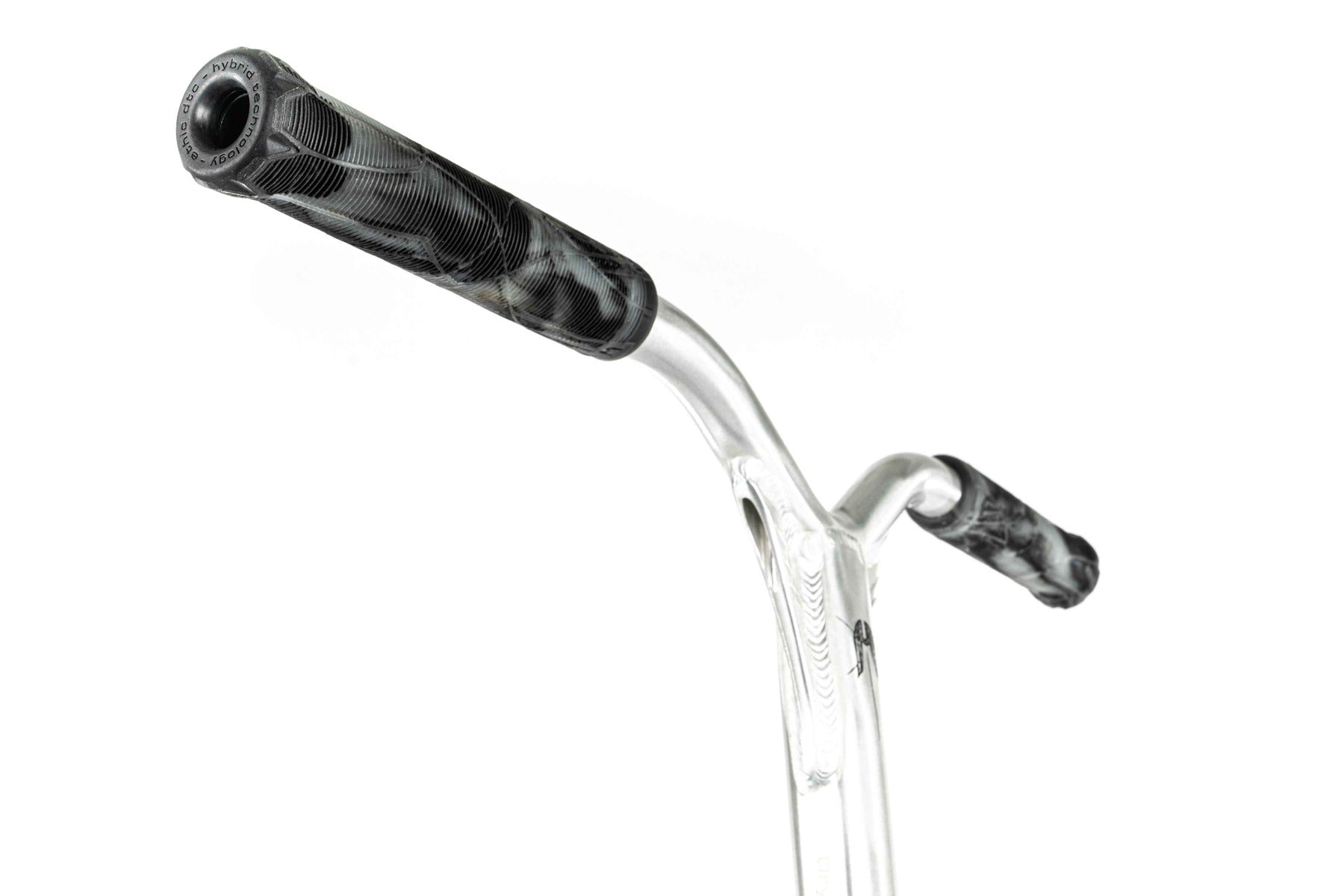 Close-up of a transparent scooter handlebar with black and white patterned grips, similar to those found on the Ethic DTC Erawan V2 Complete Stunt Scooter (M) - Brushed Silver. The curved handlebar accentuates the stylish grips against a simple white background, perfectly complementing its IHC compression system.