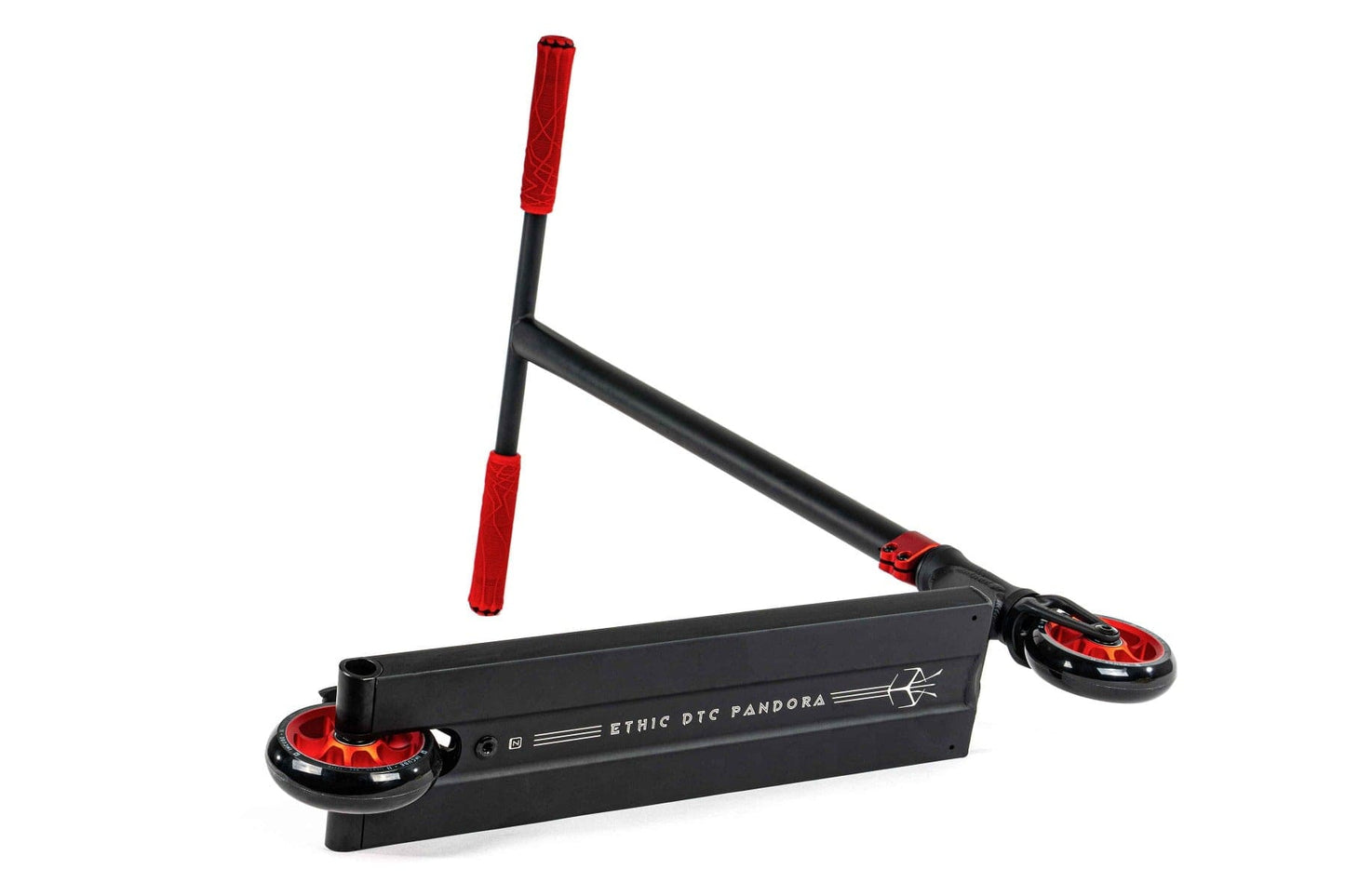 The Ethic DTC Pandora Complete Stunt Scooter (L) - Red is a black and red scooter ideal for street riding. It features a durable chromoly steel T-bar with eye-catching red grips. The deck is marked with "Ethic DTC Pandora," and its small wheels have bold red rims. Positioned upside down, the scooter's intricate underside details are revealed.