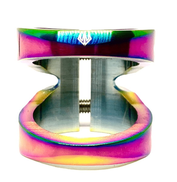 Standing vertically against a pristine white background is the Entity Exile 2 Bolt Oversized Stunt Scooter Clamp in Neochrome, featuring a durable metallic build that resembles an open, segmented clamp with a central bolt.