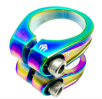 A vibrant, neochrome-colored scooter clamp with a metallic finish from Entity, inspired by the Entity Exile 2 Bolt Oversized Stunt Scooter Clamp. This lightweight yet durable piece features two bolts for securing to the frame, and its reflective surface highlights its colorful gradient design.