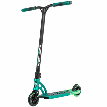 The Madd Gear MGP VX Origin Team Edition Complete Stunt Scooter in Petrol/Cyan showcases the brand's signature lightweight design. It features a solid frame, a pair of wheels, and a textured deck for enhanced grip. The vertical handlebar is adorned with "Madd Gear" branding and is equipped with teal grips that ensure both performance and durability.