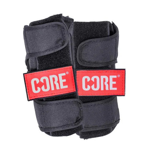 The CORE Classic Skate Protection Wrist Guards in black feature adjustable straps, bright red labels with "CORE" in white text, and reinforced splints designed for optimum protection.