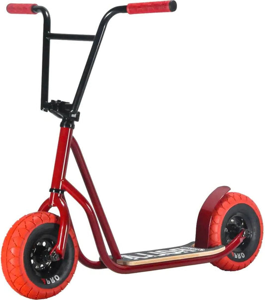 The Rocker Rolla Big Wheel Complete Scooter - Red by Rocker is designed with a striking red and black color scheme and equipped with thick, bright orange tires for enhanced stability and off-road capabilities. Like mini BMX bikes, it features a robust frame and a wide footboard. The handlebars are black with red grips, making it ideal for adventurous rides.