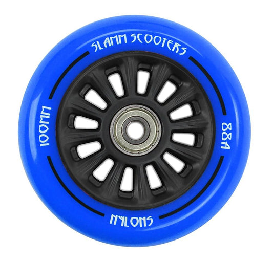 The Slamm Nylon Core 100mm Stunt Scooter Wheel in blue showcases a black hub with visible ABEC 9 Chrome Bearings. The text on the wheel reads "Slamm Scooters 100MM" and "88A NylonS," emphasizing its durable Slamm nylon core and polyurethane composite construction.