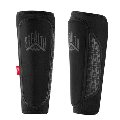 Two black GAIN Protection Stealth Shin Guards feature a textured pattern and a bold red "FENIX" label. Designed for sports, they boast KEVLAR Protection and an antibacterial lining, ensuring durability and hygiene during vigorous physical activity.