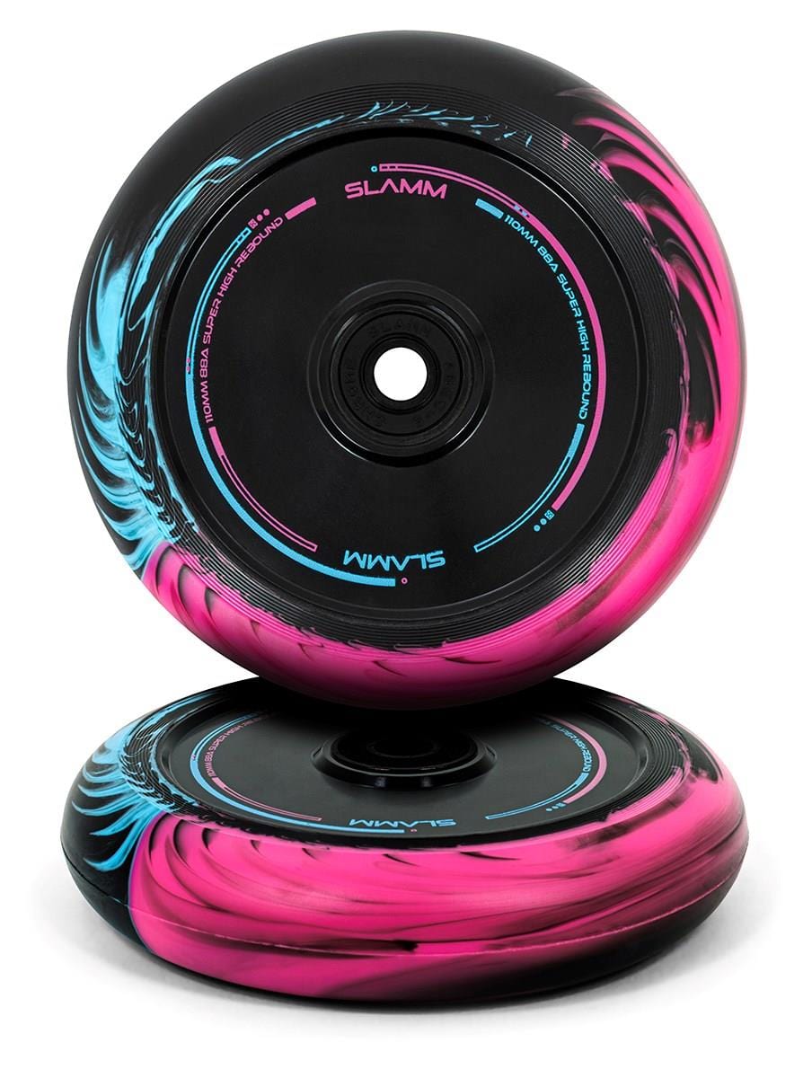 Stacked side by side, the Slamm Swirl 110mm Stunt Scooter Wheels showcase a bold and attractive design with swirling pink and blue accents set against a black background. The "Slamm" brand is prominently displayed at the center, featuring ABEC-9 chrome rubber shielded bearings for an exceptionally smooth ride.