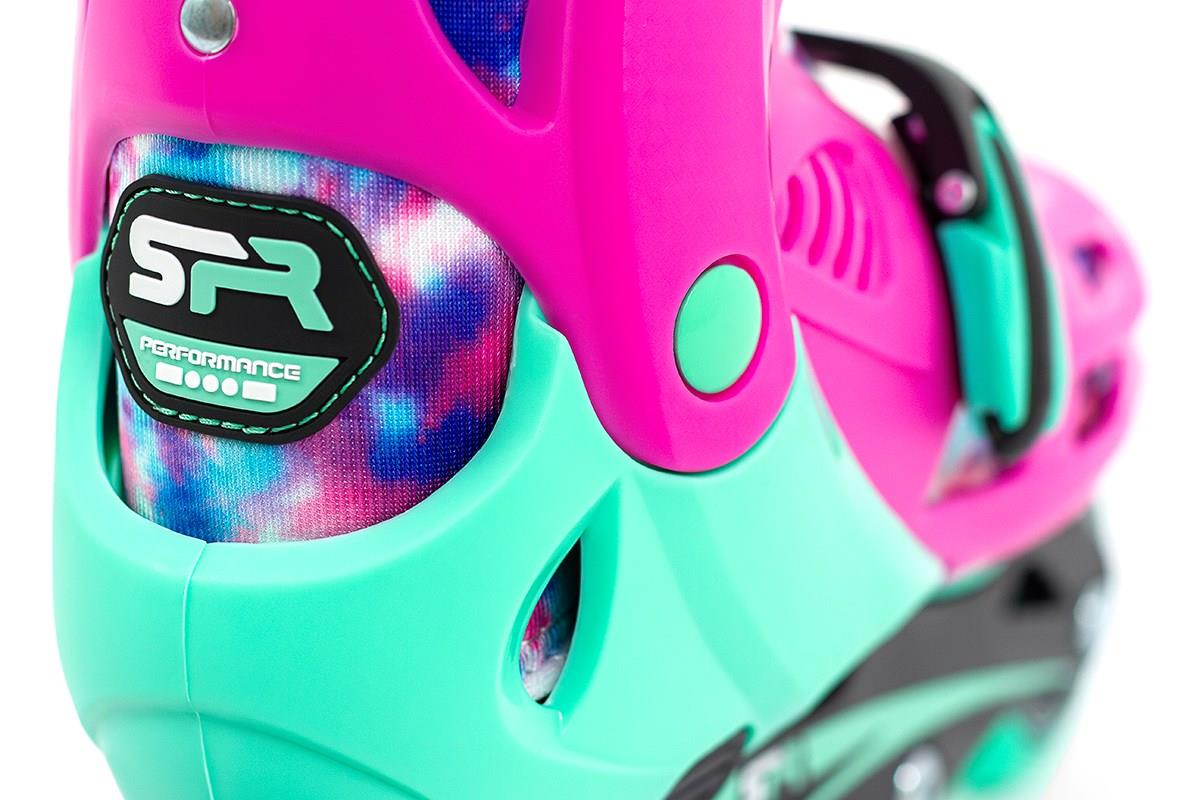 Close-up of a colorful SFR Cyclone II Adjustable Inline Skates boot showcasing a vibrant pink and teal design with a patterned interior. The words "SR Performance" are visible on the side, highlighting its adjustable sizing system and durable PU wheels.