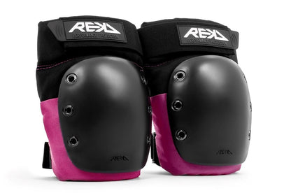 Introducing the REKD Ramp Knee Skate Protection Pads in Black/Pink, specially designed for action sports enthusiasts. These pads feature durable black hard shells and vibrant pink padding that offer exceptional impact resistance. Equipped with adjustable straps and proudly displaying the "REKD Performance Protection" logo, they are ideal for skating and other activities.