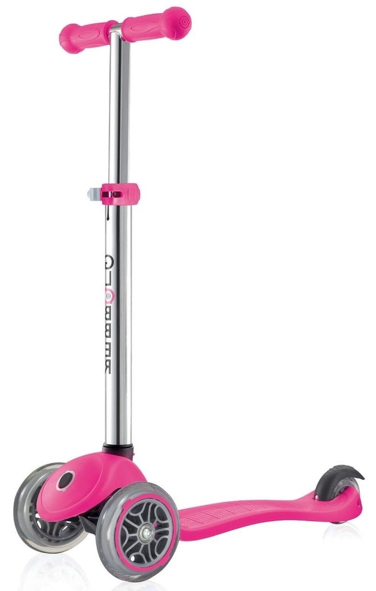 The Globber Primo Junior Kids Tri-Scooter in Neon Pink is a stylish scooter designed for kids, featuring a three-wheel structure with two front wheels and one rear wheel. It offers silver adjustable handlebars and a textured pink footboard, merging modern aesthetics with practical functionality.