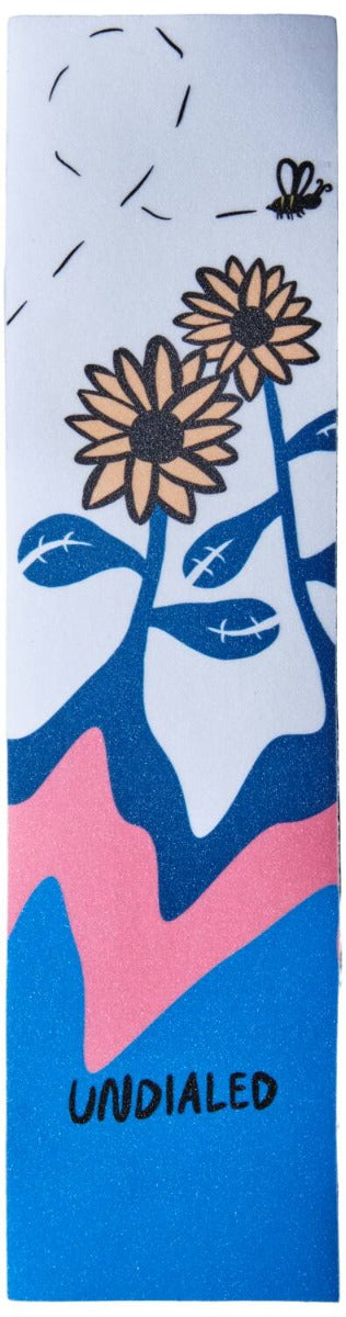 Illustration of two sunflowers with leaves, a bee, stylized clouds, and abstract shapes in blue, pink, and white is featured on the "Undialed Stunt Scooter Griptape - Flower." The word "UNDIALED" is at the bottom, capturing the vibrant energy of Instagram's largest scootering community.