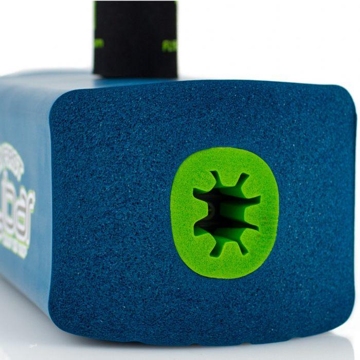 A close-up of the Flybar My First Foam Pogo Jumper showcases a blue foam exterior with a textured green inner tube that sports a star-shaped pattern, evoking the spirited design often found in children's toys. The jumper features white text alongside a black section on top, offering an engaging contrast in colors.