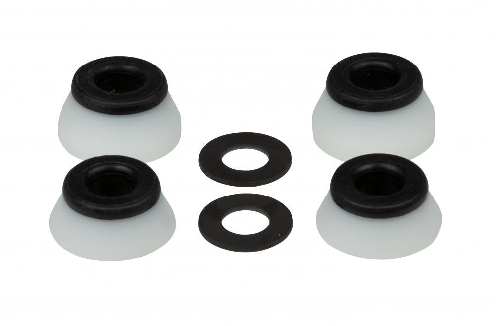 Four Bones Hardcore Black Skateboard Bushings, featuring a white rubber base with black tops and a Hard 96A rating, are arranged in a square. In between, two black washers provide balance to the setup. These items are positioned against a plain white background.