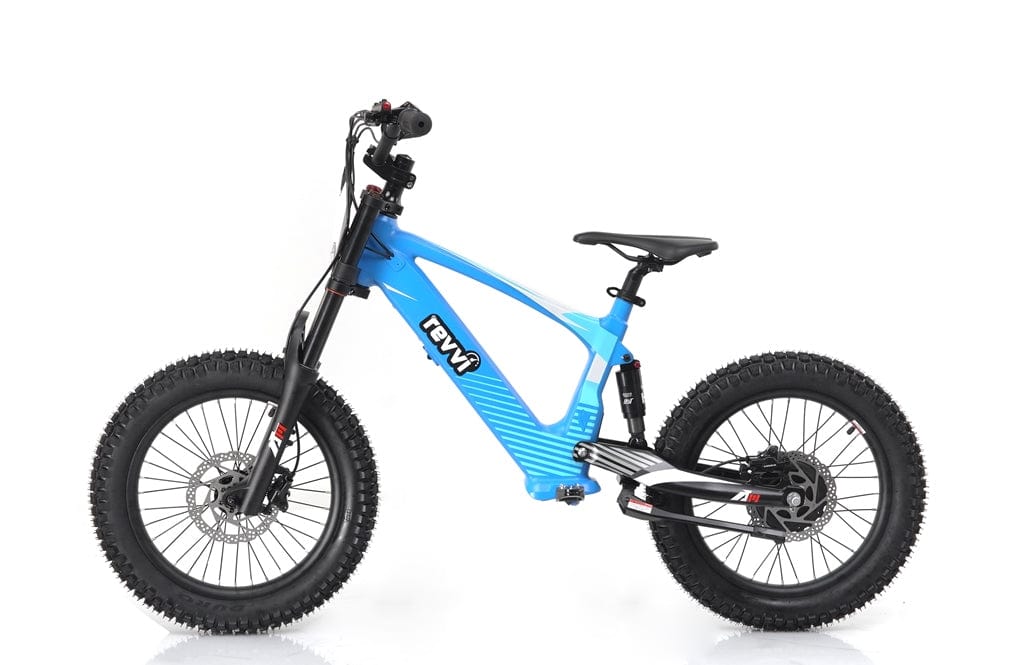 The Revvi 18" Kids Electric Balance Bike in blue is showcased against a white background, highlighting its robust frame, suspension fork, and hydraulic disc brakes, tailored for off-road adventures.