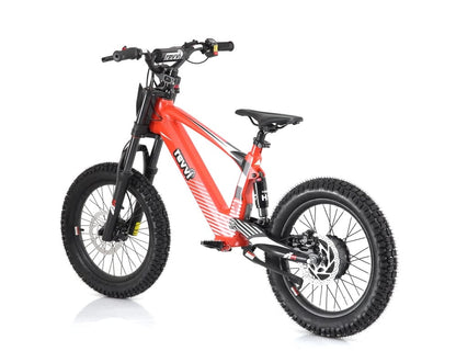 The Revvi 18" Kids Electric Balance Bike in a sleek red design features thick, rugged tires and a sturdy frame. It offers a suspension fork and comfortable saddle, perfect for both off-road adventures and urban rides—making it ideal for thrill-seekers looking for the ultimate electric balance bike experience.